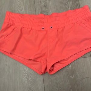 Bright pink rip curl booty shorts